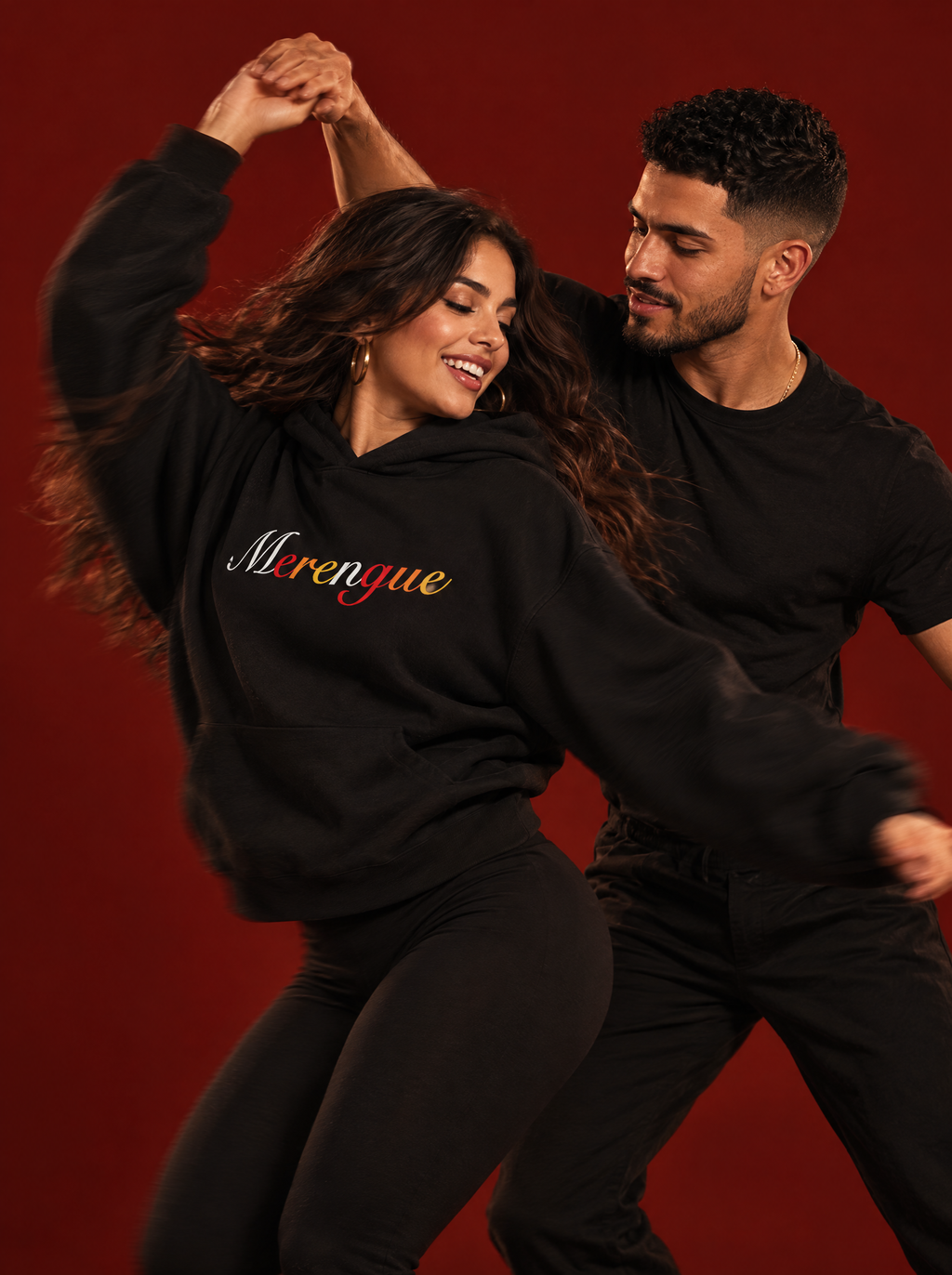 Black — Mari and Leo mid-merengue turn in the Merengue hoodie