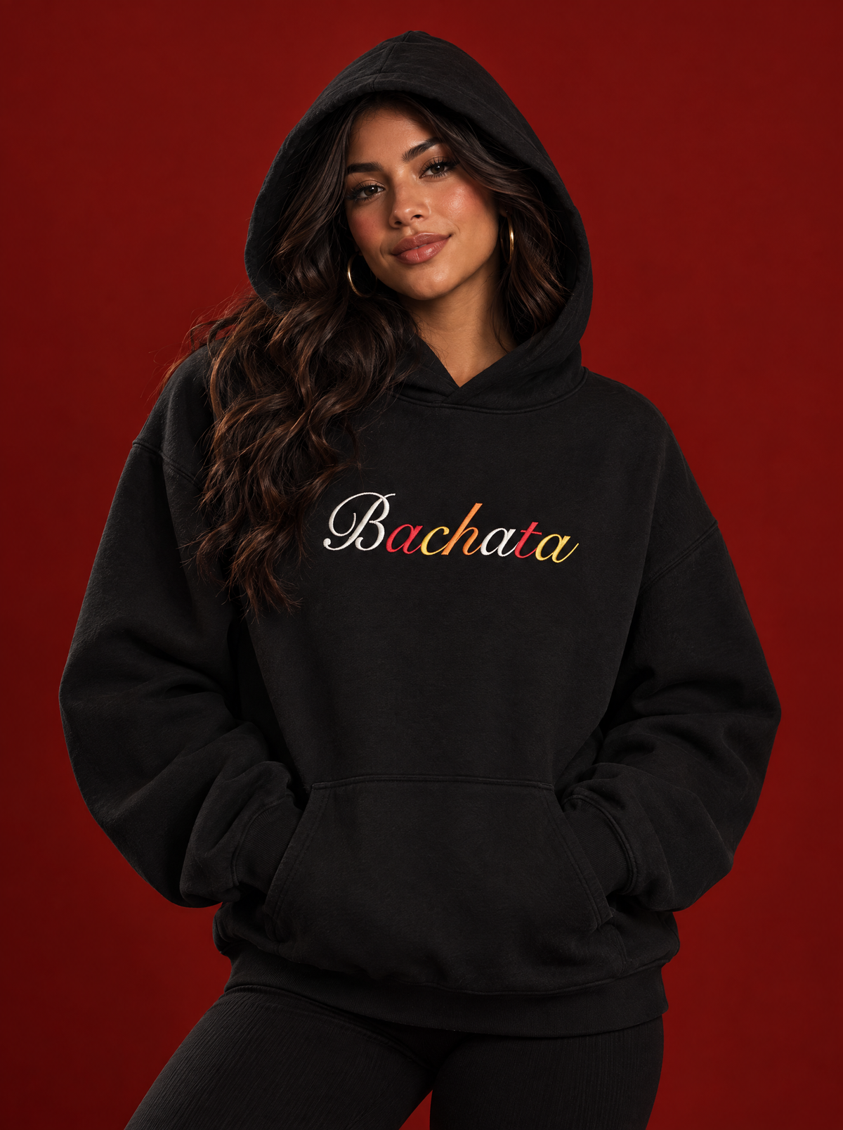 Black — Mari in the Bachata hoodie, hood up, heavyweight fleece drape
